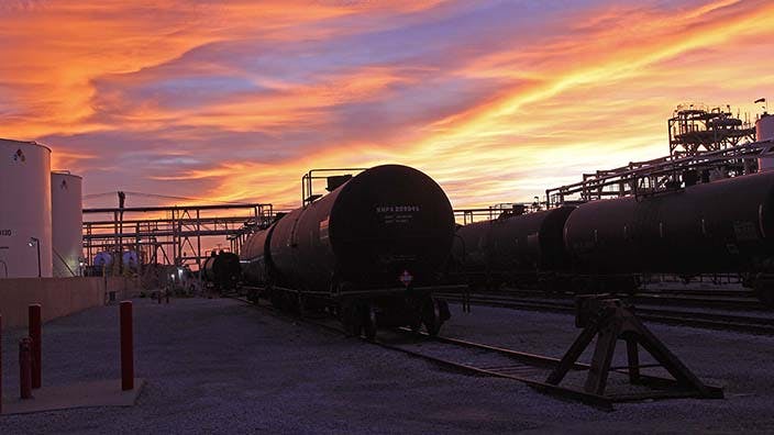 OxyChem railcars at refinery with sunset